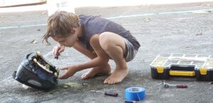 noah-fixing-a-pool-sweep-in-hawaii